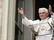 Pope Benedict XVI raises his arms in welcome to the pilgrims in St. Peter's Square?w=200&h=150