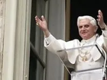 Pope Benedict XVI raises his arms in welcome to the pilgrims in St. Peter's Square