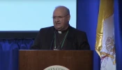 Bishop Peter Baldacchino speaks to bishops about cause for beatification and canonization of Father Richard M. Thomas on Nov. 11, 2025, at the USCCB fall plenary in Baltimore.