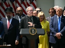 Bishop Robert Barron speaks alongside President Donald Trump (right) during a National Day of Prayer event on May 1, 2025, in the Rose Garden of the White House in Washington, D.C.