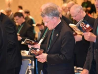 Bishops pray during the Fall General Assembly of the USCCB. 