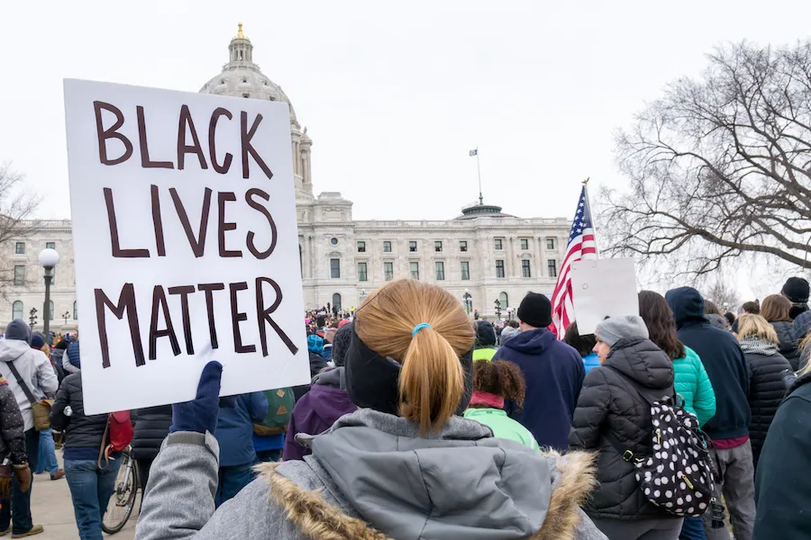 Protestor carrying Black Lives Matter sign. ?w=200&h=150