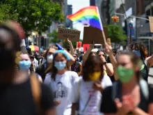 Protesters march during a "Black Trans Lives Matter" march against police brutality on June 17, 2020 in the Brooklyn Borough of New York City. 