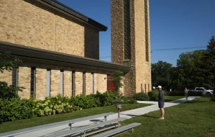 Robin Westman, 23, a man who struggled with his sexual identity, shot through the now-boarded windows of Annunciation Catholic Church in Minneapolis on Aug. 27, 2025, killing two children and injuring 21 others. Credit: Stephen Maturen/Getty Images