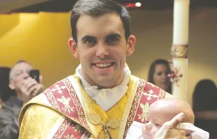 Fr. Zachary Boazman, left, after the baptism of a baby, right.   Archdiocese of Oklahoma City