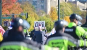 Police protect marchers at the fourth annual National Men’s March to Abolish Abortion and Rally for Personhood in Boston on Nov. 1, 2025.