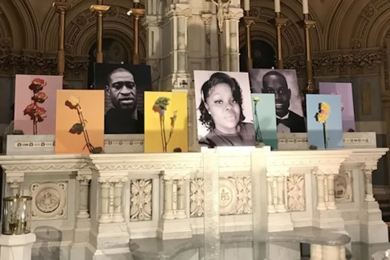 Photos of George Floyd, Breonna Taylor, and Ahmaud Arbery on a side altar at St. Francis Xavier Church in New York City. Courtesy photo.