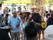 Bishop Joseph Brennan of Fresno speaks at a rally of the UFW march for a labor union voting rights bill in Calwa, Calif., Aug. 11, 2022.