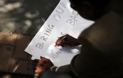 A man makes a sign outside the Permanent Mission of Nigeria to the United Nations on June 2, 2014 in New York City. ?w=200&h=150