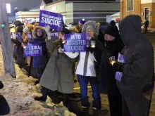 Disabilities advocates in Buffalo, New York, during a candlelight vigil in opposition to assisted suicide.