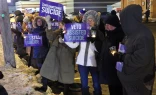 Disabilities advocates in Buffalo, New York, during a candlelight vigil in opposition to assisted suicide.