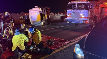 First responders provide aid after a bus carrying a group of mostly teenagers from Our Lady of Guadalupe Catholic Church in Santa Ana, California, on its way home from a three-day retreat at Camp Nawakwa in the San Bernardino Mountains crashed on a two-lane highway near Running Springs on Nov. 9, 2025.