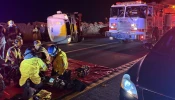 First responders provide aid after a bus carrying a group of mostly teenagers from Our Lady of Guadalupe Catholic Church in Santa Ana, California, on its way home from a three-day retreat at Camp Nawakwa in the San Bernardino Mountains crashed on a two-lane highway near Running Springs on Nov. 9, 2025.