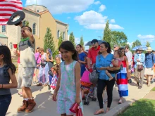 Families joined the procession as the Eucharist left the Shrine of St. Rose Philippine Duchesne, headed for St. Peter Parish.