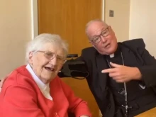Cardinal Timothy Dolan, archbishop of New York, with Sister Mary Bosco of the Sisters of Mercy, a 100-year-old Irish nun who taught him to “love and serve the Lord.”