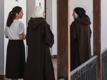 Mother Ana María and Sister Raquel, Carmelite hermits in Spain, together with a young postulant.