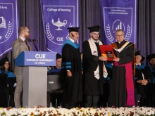 A student receives his diploma during a graduation ceremony at the Catholic University of Erbil in Iraq on Sept. 30, 2025.