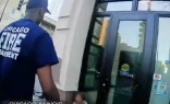 Chicago firefighters attend to a woman outside a doorway in video taken in November 2025 by Coalition Life.