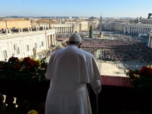 With a cane in his right hand, 86-year-old Pope Francis delivers his 10th Christmas "Urbi et Orbi" blessing on Dec. 25, 2022.