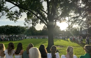 Camp Mystic alumnae and family sing after a memorial service on July 7, 2025, honoring victims of the flash floods in Central Texas over the Fourth of July weekend. Credit: Amira Abuzeid/CNA