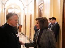 Archbishop Timothy Broglio speaks with Rep. Nancy Pelosi after a Mass held at the U.S. Capitol on the feast of Our Lady of Guadalupe, Dec. 12, 2024.