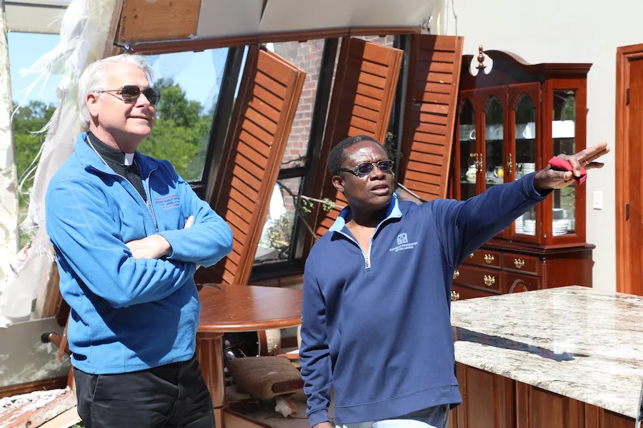Archbishop Paul Coakley and Fr. Oby Zunmas inspect damage at Holy Cross Catholic Church. ?w=200&h=150