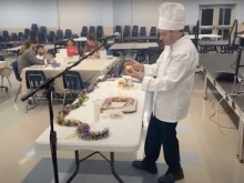 Father Robert Cooper on the set of his online cooking show.