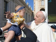 Pope Francis waves during his Angelus address at the Vatican, Aug. 8, 2021.