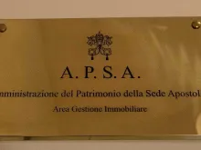 The banner at the entrance of the APSA office in the Vatican.