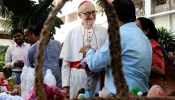 Cardinal Michael Felix Czerny, SJ, head of the Dicastery for Promoting Integral Human Development, visits a stall of Caritas Bangladesh on Nov. 4, 2025, in Dhaka.
