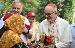 Cardinal Michael Czerny, SJ, receives flowers from Rohingya during his visit to Cox’s Bazar, considered the world’s largest refugee camp, on Sunday, Nov. 3, 2025. Credit: Caritas Bangladesh