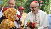 Cardinal Michael Czerny, SJ, receives flowers from Rohingya during his visit to Cox’s Bazar, considered the world’s largest refugee camp, on Sunday, Nov. 3, 2025.
