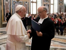 Pope Francis greets a representative of the De La Salle Brothers at the Vatican's Clementine Hall, May 16, 2019. 