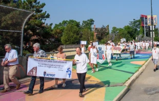 Members of the Catholic nonprofit Strangers No Longer and others march to the Detroit ICE headquarters in July 2025. Credit: Tom Tomala, Strangers No Longer