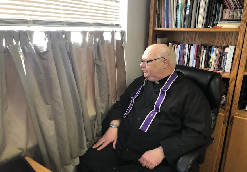Fr. Douglas Dietrich prepares to hear confessions at his office window, at St. Mary's Parish in Lincoln, Neb. ?w=200&h=150