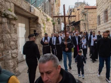 Students and teachers from Jerusalem Christian schools walk the Way of the Cross on the Via Dolorosa in Jerusalem. The yearly event was organized by the Custody of the Holy Land on Friday, Feb. 23, 2024, on the occasion of Lent.