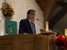 Longtime Channel 4 (WDIV-TV in Detroit) personality Chuck Gaidica speaks Oct. 27, 2022, at St. Stephen Church, part of Holy Trinity Parish in Port Huron, Michigan, about his recent reconversion to the Catholic faith of his youth. Gaidica, who spent many years as a nondenominational pastor in Detroit after his news days, said he was urged to return to the Church eight years ago by a woman at St. Stephen.