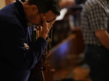 A man prays the rosary during a daylong event on Sept. 30, 2023, in Washington, D.C., focused on praying and reflecting on the rosary to conclude a nine-month rosary novena.