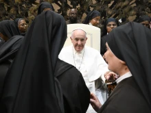 Pope Francis greets religious sisters at the end of his general audience on Aug. 10, 2022.