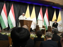 Pope Francis addresses civil authorities and other dignitaries at a former a Carmelite monastery in Budapest, Hungary, on April 28, 2023, on the first day of his three-day pilgrimage to the country.