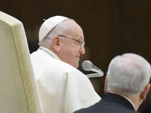 Pope Francis delivers a message at his general audience on Wednesday, Jan. 31, 2024.