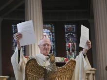 Archbishop Dermot Farrell of the Dublin Archdiocese holds up the decree on Nov. 14, 2025, that Pope Leo XIV sent him granting his request that St. Mary’s Pro Cathedral of the Archdiocese of Dublin be designated as the cathedral Church of the archdiocese.