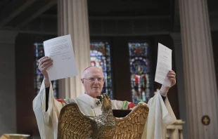Archbishop Dermot Farrell of the Dublin Archdiocese holds up the decree on Nov. 14, 2025, that Pope Leo XIV sent him granting his request that St. Mary’s Pro Cathedral of the Archdiocese of Dublin be designated as the cathedral Church of the archdiocese. Credit: John McElroy/Dublin Archdiocese