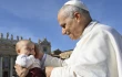 Pope Leo XIV blesses a baby on All Saints Day’ 2025.
