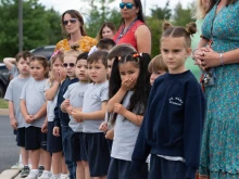 School children from St. Mary Academy watch the Eucharistic Procession on the campus of their home parish, St. Mary
of the Pines Church, Manahawkin, New Jersey, May 29, 2024.