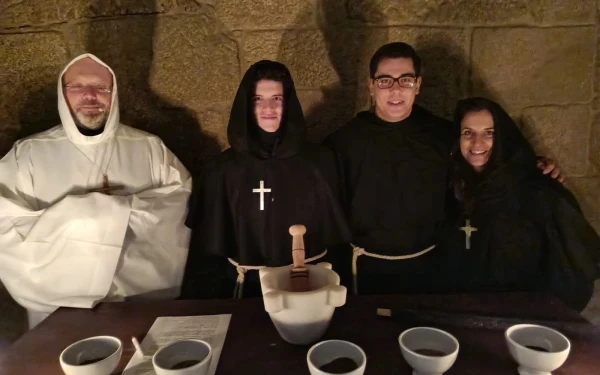 Chouciño, on the left, in white, with some of the actors in the "escape room." Credit: Photo courtesy of Father Miguel Chouciño