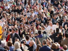 Pope Francis greets pilgrims at his general audience in St. Peter's Square on Wednesday, Sept. 18, 2024.