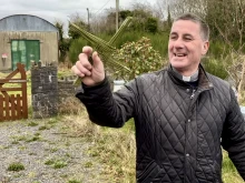 Father Patrick Hughes shows how to make a traditional St. Brigid's Cross in County Cavan, Ireland.