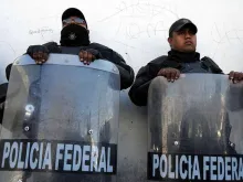 Mexican federal police in riot gear. 
