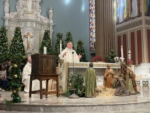 From left to right: Auxiliary Bishop of the Our Lady of the Angels Pastoral Region Matthew G. Elshoff, St. Monica pastor Father Lloyd Torgerson, and Corpus Christi pastor Monsignor Liam Kidney celebrate Mass at St. Monica Church with Corpus Christi’s surviving tabernacle next to the altar on Jan. 12, 2025.